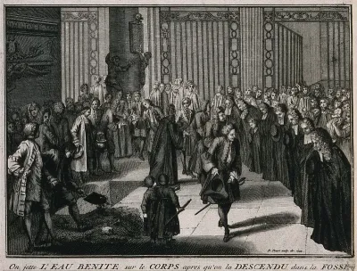 A funeral in a French church: the coffin is sprayed with holy water and lowered into the grounds of the church