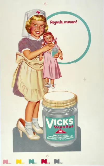 A girl playing at being a nurse by rubbing "Vick" ointment on the chest of a doll