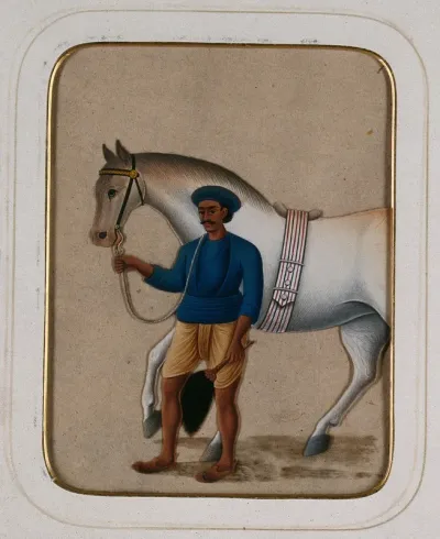 A groom leading a horse