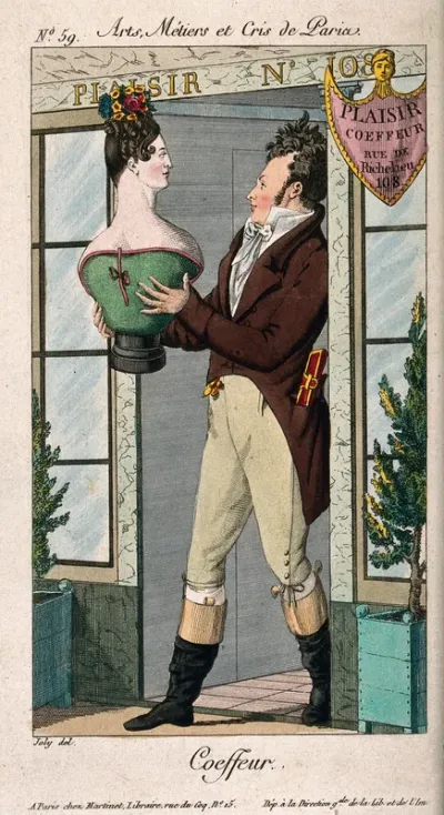 A hairdresser holding a bust of a woman with an elaborate hairstyle