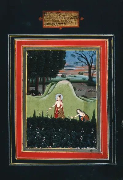 A high ranked Indian woman walking in the garden followed by another woman picking flowers
