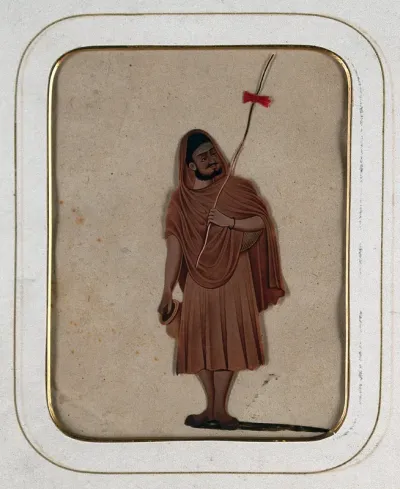A holy man holding a stick and a water pot