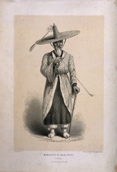 A Korean man in large hat stands smoking a pipe