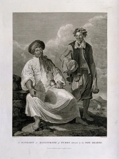 A large Chinese man sits on a rock fanning himself as his pipe-bearer stands by
