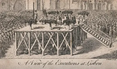 A large crowd surrounds a platform on which victims are tortured by means of racks and crosses