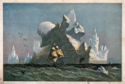 A large iceberg with a ship sailing past it
