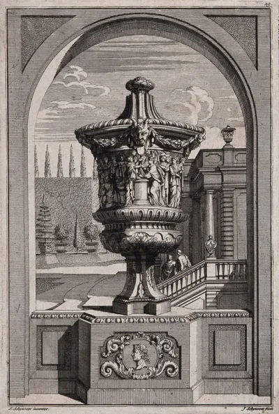 A large, ornate vase with figures joining hands carved in relief on the side, in a classical garden
