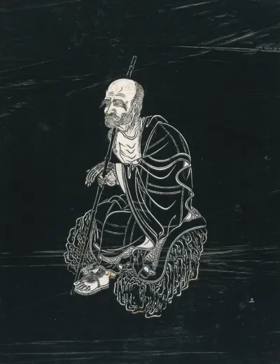 A Lohan (disciple of Buddha), seated on a rock holding a staff