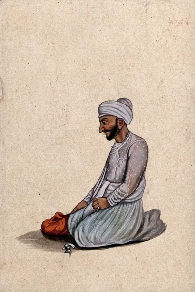 A Lucknow courtier kneeling, with a red cloth bundle beside him