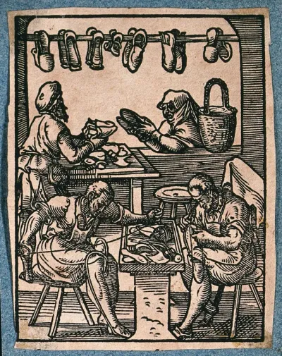 A maker of shoes and boots is selling shoes to a woman at the window of his workshop, as his assistants sew and hammer footwear