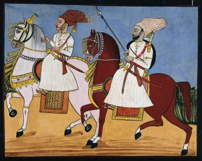 A male and female attendant riding on horses