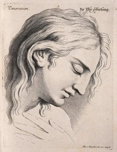 A male face with head bowed, expressing veneration