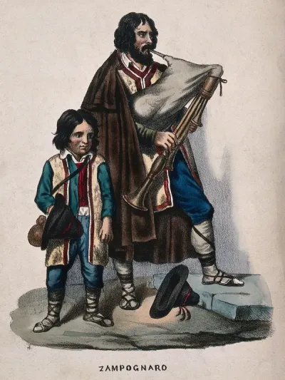A man accompanied by a child is playing the bagpipes