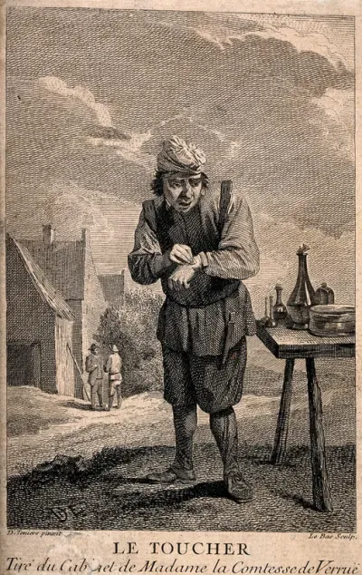 A man applying a plaster to his hand outside in a rural setting; representing the sense of touch