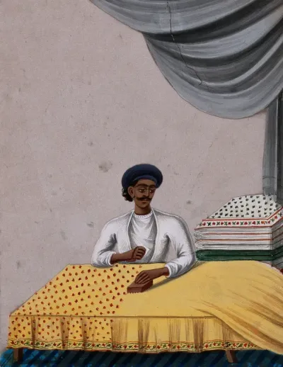 A man block printing on textiles