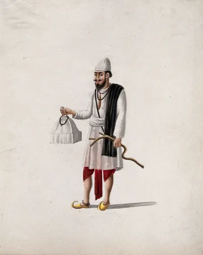 A man carrying a model of a tomb (?), decorated with prayer beads