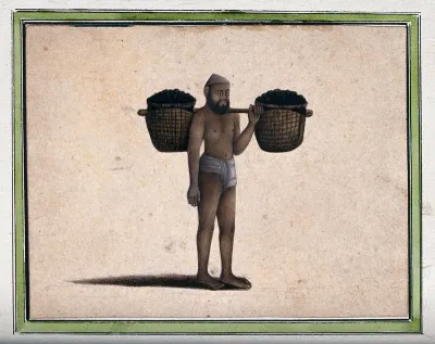 A man carrying two baskets filled with coal (?) attached to a stick, on his shoulder