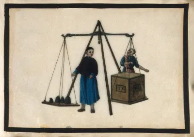 A man checks the weight of a crate of tea, which has been placed on a large balance