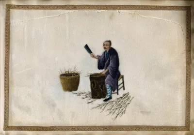 A man chopping twigs on a wooden block, perhaps as fuel (?) for an oven used in processing harvested tea