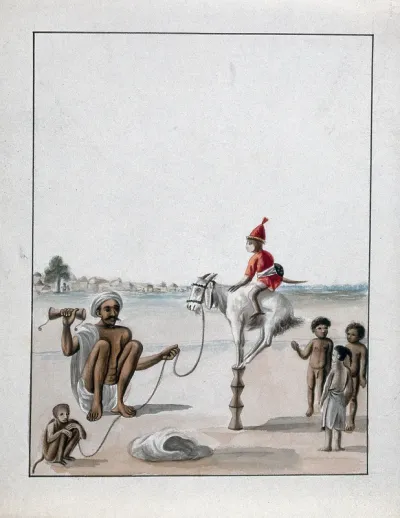A man conducting a monkey show on the street, watched by some children