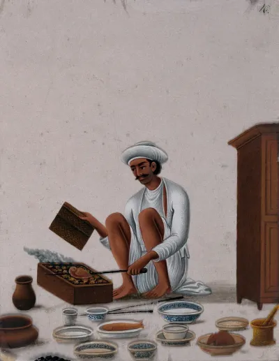 A man cooking meat on an Indian barbeque