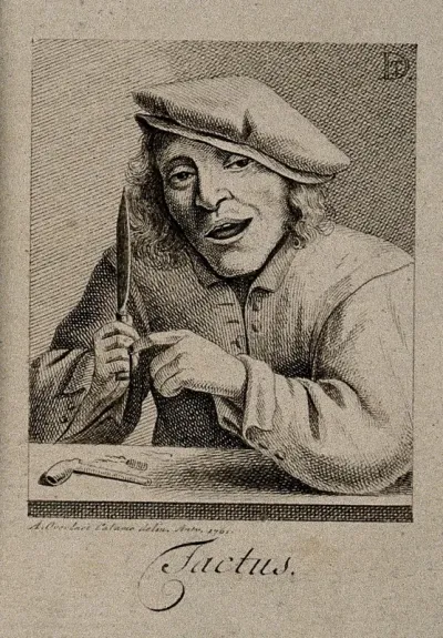 A man cuts his finger with a knife; representing the sense of touch