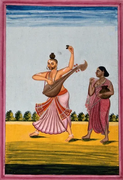 A man dancing while playing a string instrument and castanets, with a standing woman