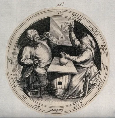 A man drinks from a glass as a woman holds a jug and raises her hand in the air