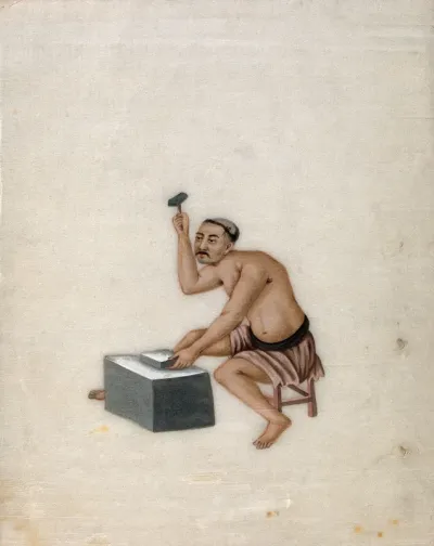A man hammering metal (?), to make a mirror (?)