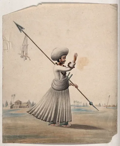 A man holding a long arrow with two puppets (?) hanging from it