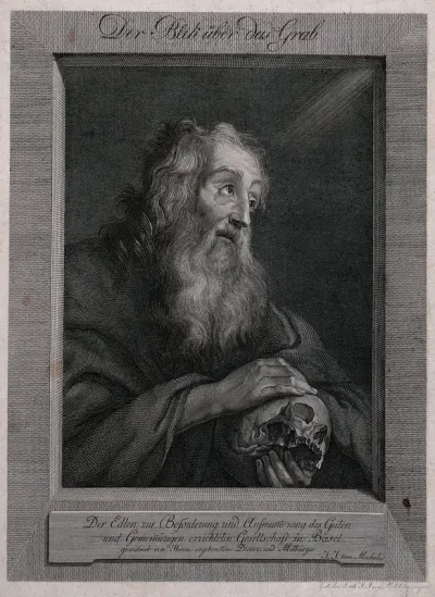 A man holding a skull