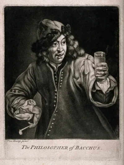 A man in a fur cap holding a drinking glass in one hand and a pipe in the other