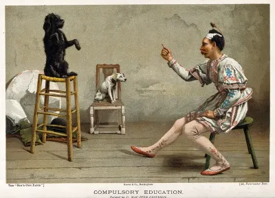 A man in an acrobat's outfit teaches a dog a trick while another dog looks on
