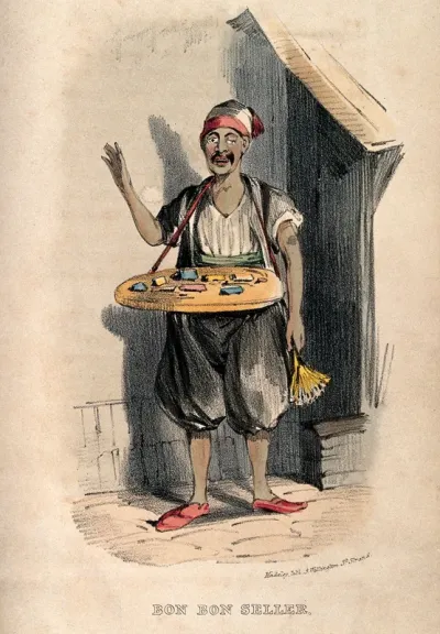 A man in Damascus selling sweets from the tray around his neck