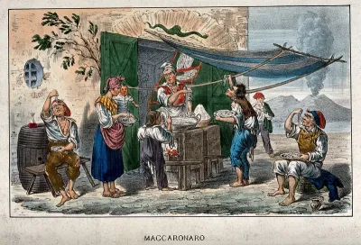 A man in Naples has set up a stall under an awning and he is selling macaroni to families and travellers
