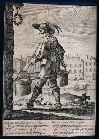 A man in Paris carrying two pails of water suspended from straps on his back along the bank of the river Seine