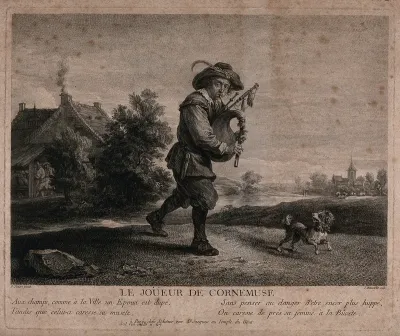 A man is carrying a set of bagpipes as he leaves a village with a dog running at his feet
