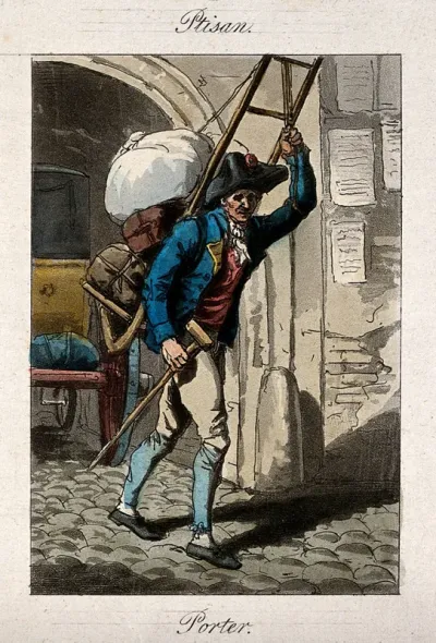 A man is carrying bags and bundles on his back