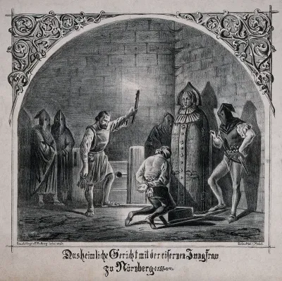 A man is forced to kneel before an "iron maiden" in a dungeon in Nuremberg