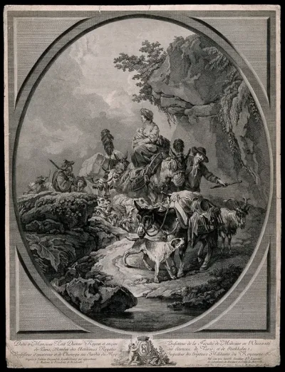 A man is leading a woman and her baby on a donkey with their belongings and a flock of sheep, attended by other people