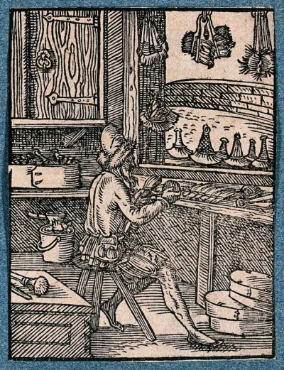 A man making brushes at his work bench