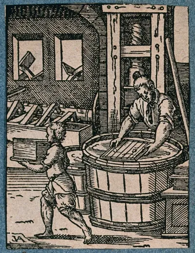 A man making paper; his apprentice carrying away the finished sheets