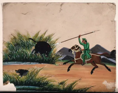 A man on horseback running a spear into a wild boar