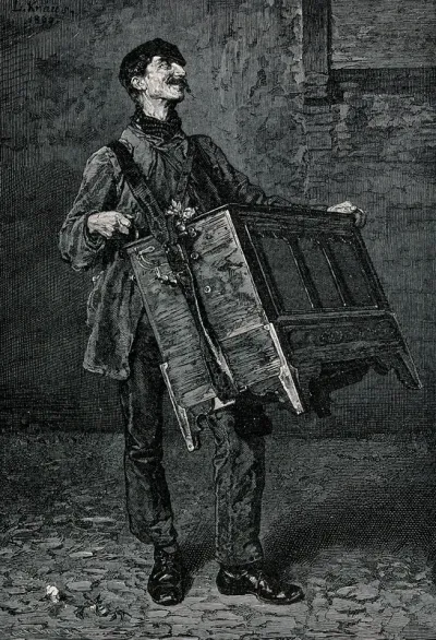A man playing a barrel organ