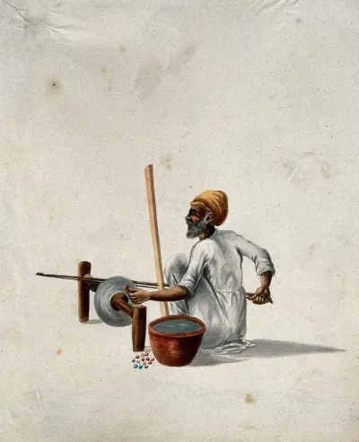 A man polishing semi-precious (?) stones