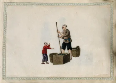 A man pounding tea leaves down into a large wooden box with a large pestle, watched by a small boy