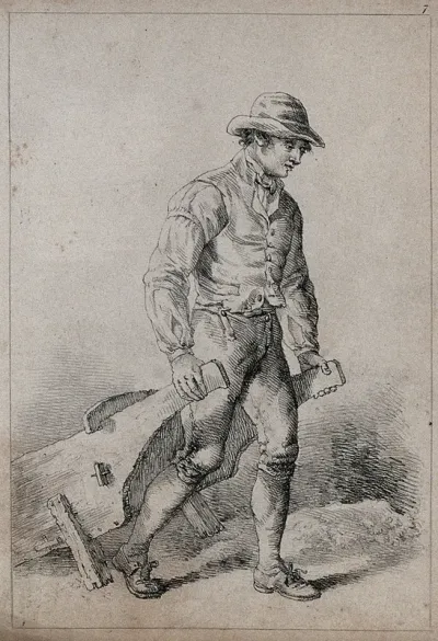 A man pulling a wheelbarrow