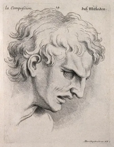 A man's face inclined forward, expressing compassion