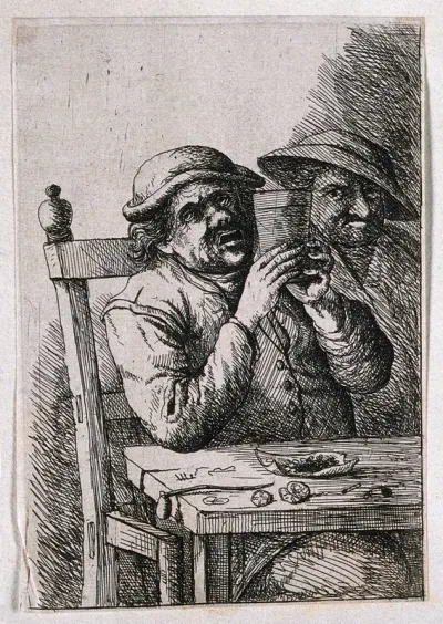 A man sits at a table with drink, pipe and tobacco; another looks on and grimaces