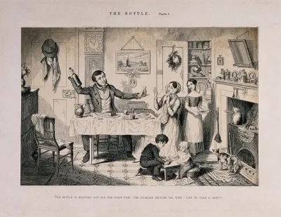 A man sits at home with his family and offers his wife a drink